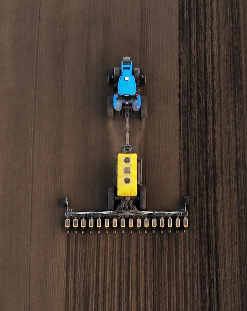 Precision vision spraying system and tractor in a crop field on mobile